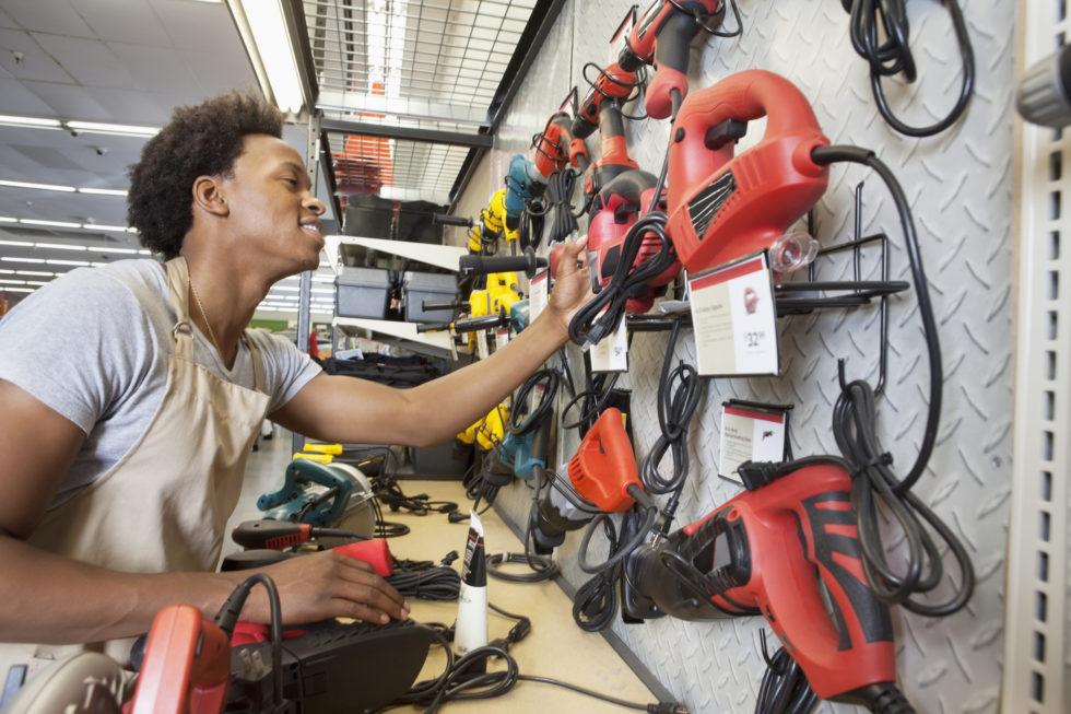 Man-working-at-hardware-shop-980x653