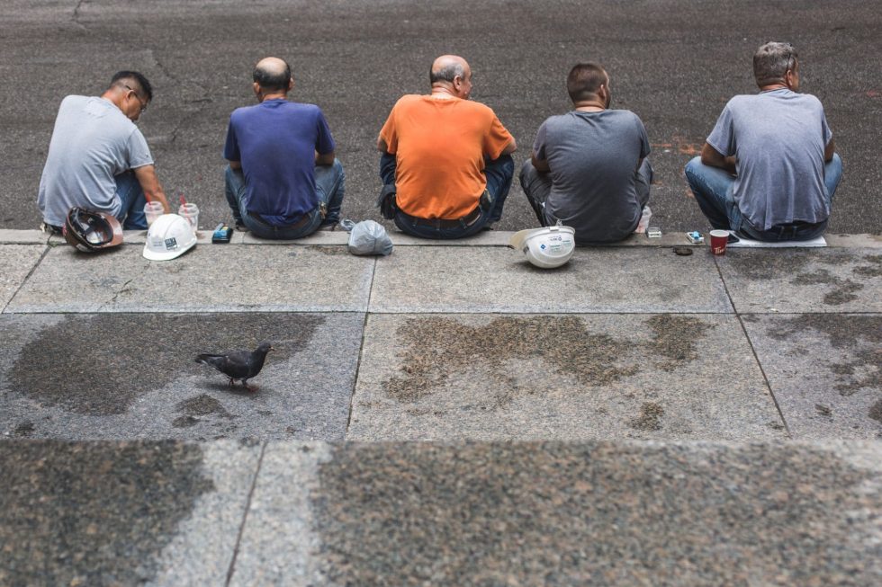 five-construction-workers-on-break-980x653