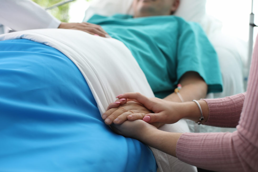patient-in-hospital-bed-980x653