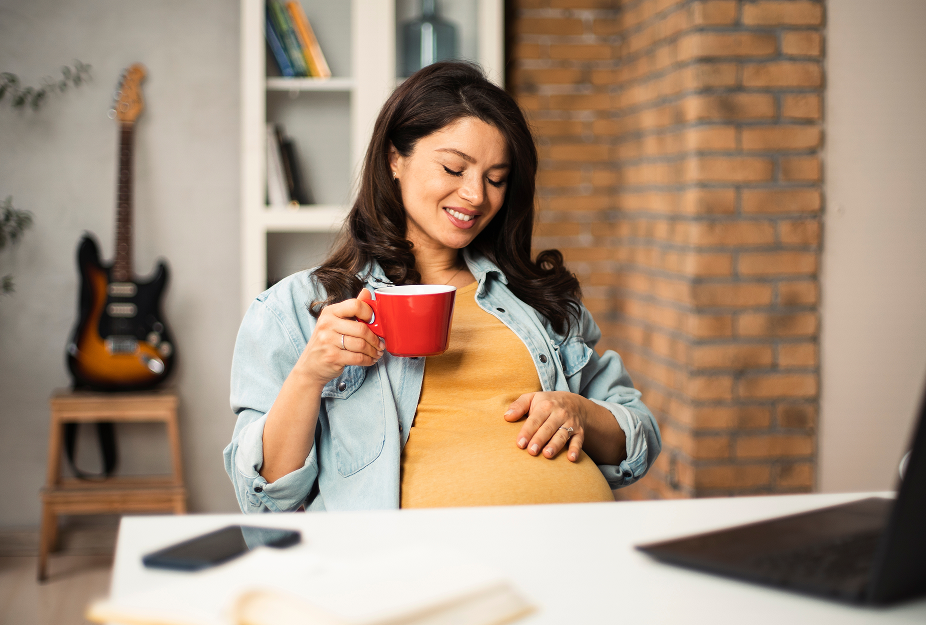 pregnant woman at desk